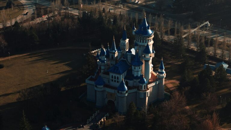 Dreamy aerial photo of a fairytale castle in Turkey set in a lush park.
